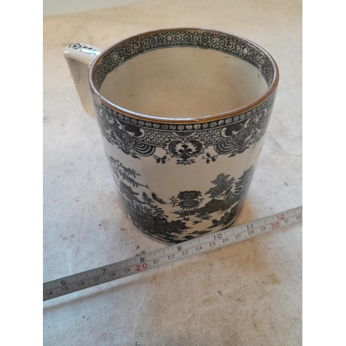 292 - 19th century pottery tankard with transfer printed decoration. one frit to rim