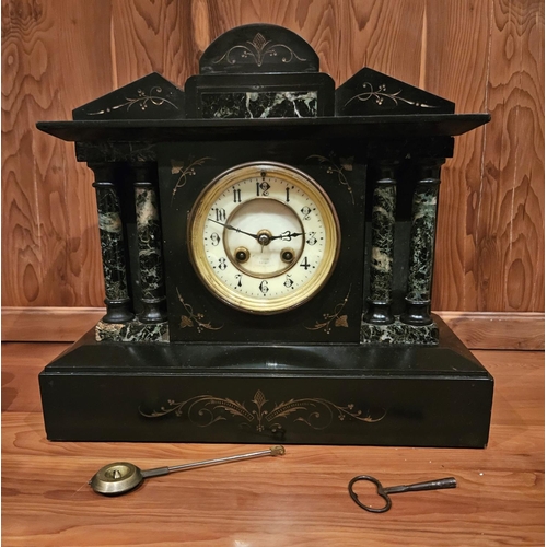 388 - Late Victorian slate mantle clock 35cm w x 15.2cm d x 32cm h pendulum and key present. Strikes hour ... 