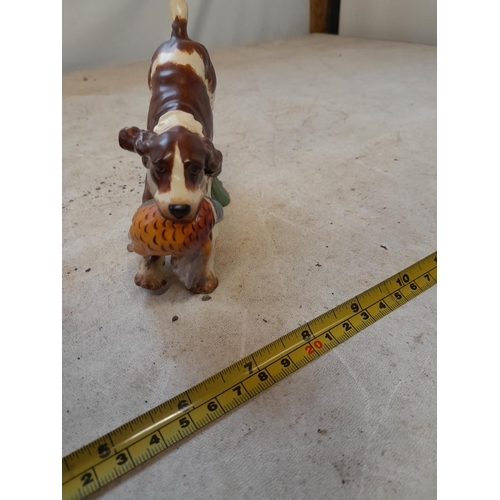 40 - Royal Worcester  Spaniel with pheasant by Doris Lidner note pheasant tail broken off