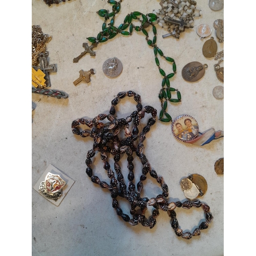 279 - Costume jewellery, badges, rosaries, very small amount of silver included