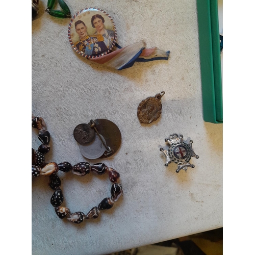 279 - Costume jewellery, badges, rosaries, very small amount of silver included