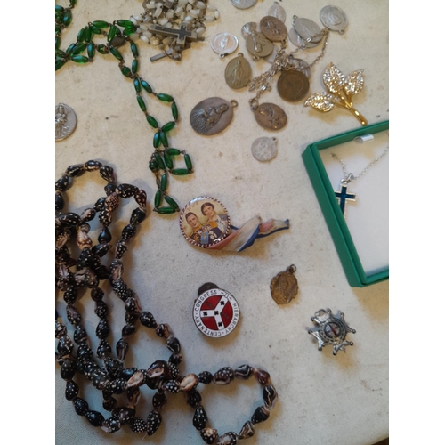 279 - Costume jewellery, badges, rosaries, very small amount of silver included