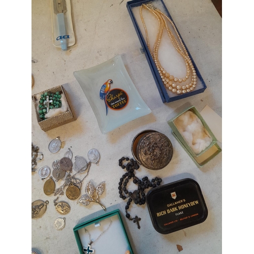 279 - Costume jewellery, badges, rosaries, very small amount of silver included