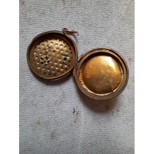 18 - Vintage gold front and back photograph locket set with rubies, some stone missing