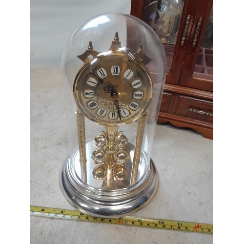 26 - Perpetual clock in plastic dome and jewellery box