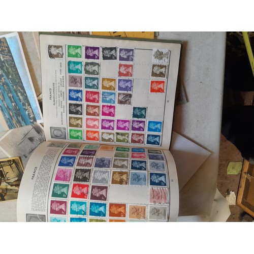 33 - Stamps and postcards : well filled world stamp album dating from 19th - late 20th century with colou... 