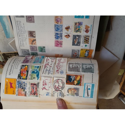 33 - Stamps and postcards : well filled world stamp album dating from 19th - late 20th century with colou... 