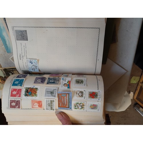 33 - Stamps and postcards : well filled world stamp album dating from 19th - late 20th century with colou... 