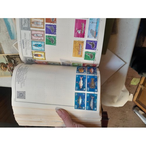 33 - Stamps and postcards : well filled world stamp album dating from 19th - late 20th century with colou... 