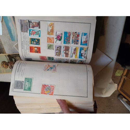 33 - Stamps and postcards : well filled world stamp album dating from 19th - late 20th century with colou... 