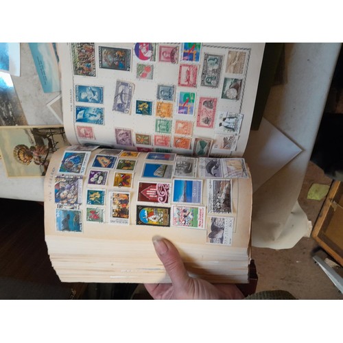 33 - Stamps and postcards : well filled world stamp album dating from 19th - late 20th century with colou... 