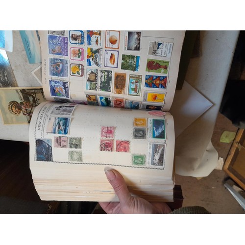 33 - Stamps and postcards : well filled world stamp album dating from 19th - late 20th century with colou... 