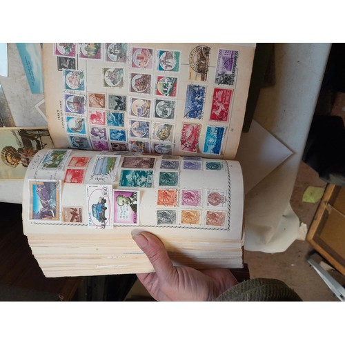 33 - Stamps and postcards : well filled world stamp album dating from 19th - late 20th century with colou... 