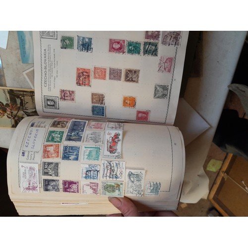 33 - Stamps and postcards : well filled world stamp album dating from 19th - late 20th century with colou... 