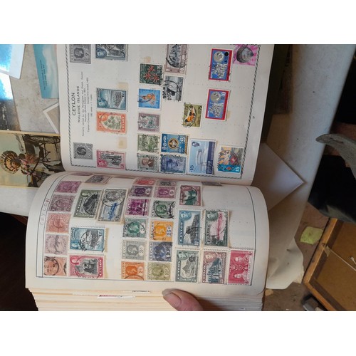 33 - Stamps and postcards : well filled world stamp album dating from 19th - late 20th century with colou... 