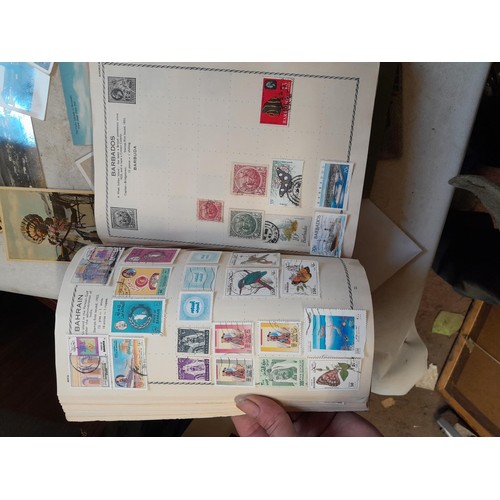 33 - Stamps and postcards : well filled world stamp album dating from 19th - late 20th century with colou... 