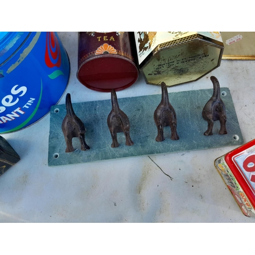 63 - Advertising and other vintage tins & dog tail coat rack