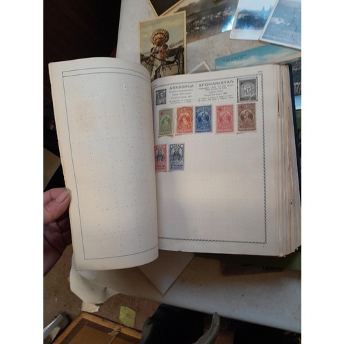 33 - Stamps and postcards : well filled world stamp album dating from 19th - late 20th century with colou... 