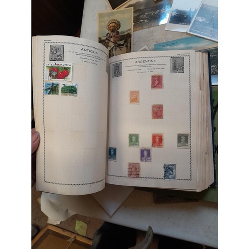 33 - Stamps and postcards : well filled world stamp album dating from 19th - late 20th century with colou... 