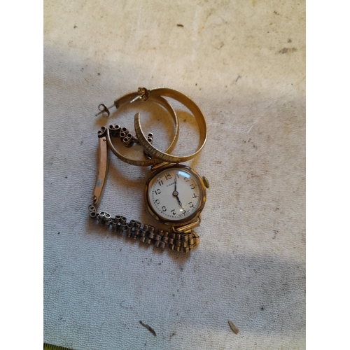 312 - Vintage ladies rolled gold wristwatch and gold plated earrings