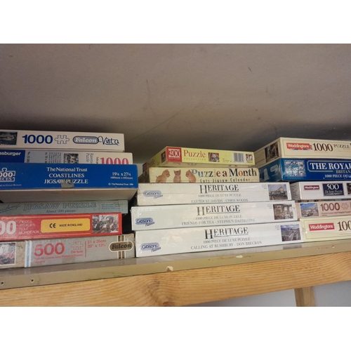 67 - Collection of new and sealed and other board games and jigsaws some with railway theme