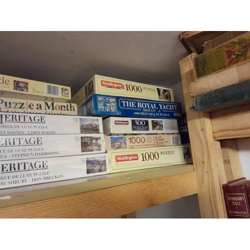 67 - Collection of new and sealed and other board games and jigsaws some with railway theme