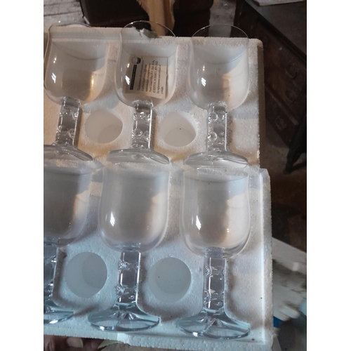 104 - Assorted catering glasses in a large tea chest sized box , coupes and other some boxed old stock