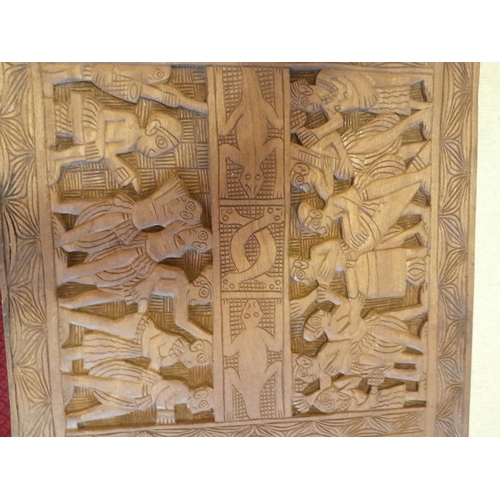 19 - Interesting carved hardwood panel on later base as a coffee table 80 cms x 49 cms x 37 cms