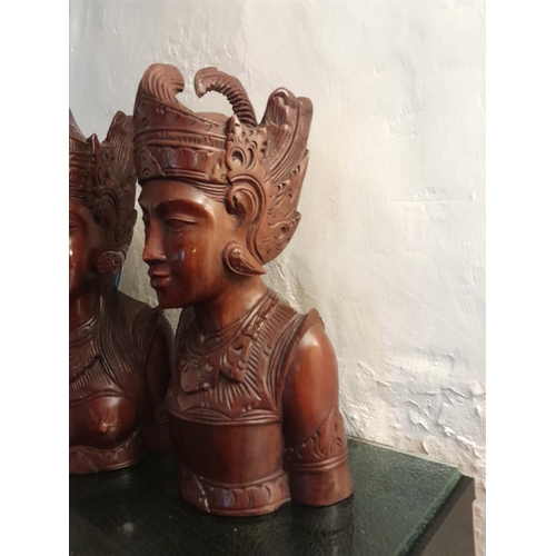 83 - Pair of 20th century carved South East Asian hardwood busts