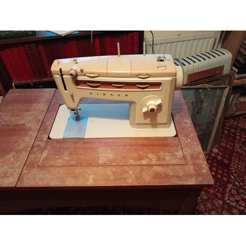 105 - Vintage Singer sewing machine & nest of mahogany tables