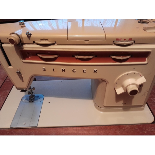 105 - Vintage Singer sewing machine & nest of mahogany tables