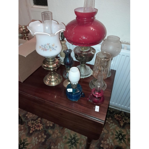 117 - Various paraffin lamps and shades