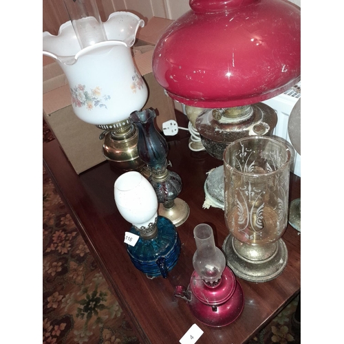 117 - Various paraffin lamps and shades