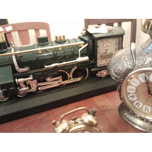 124 - Assorted vintage clocks : Metamec, plastic railway quartz clock