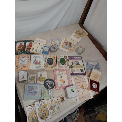 143 - World of Beatrix Potter and Peter Rabbit collectables : books, tins, enamel trinket box