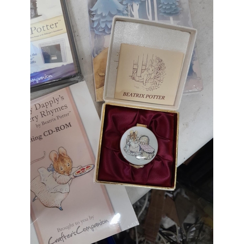 143 - World of Beatrix Potter and Peter Rabbit collectables : books, tins, enamel trinket box