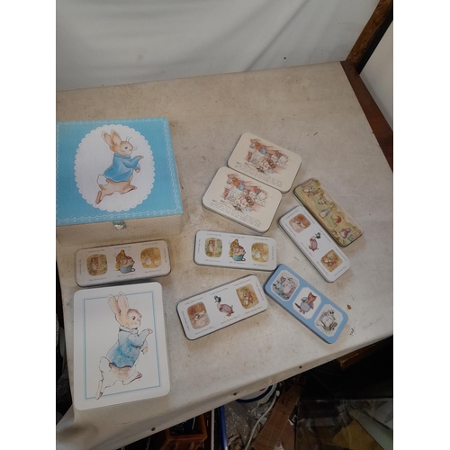 160 - World of Beatrix Potter and Peter Rabbit collectables : various tins and pencil tins