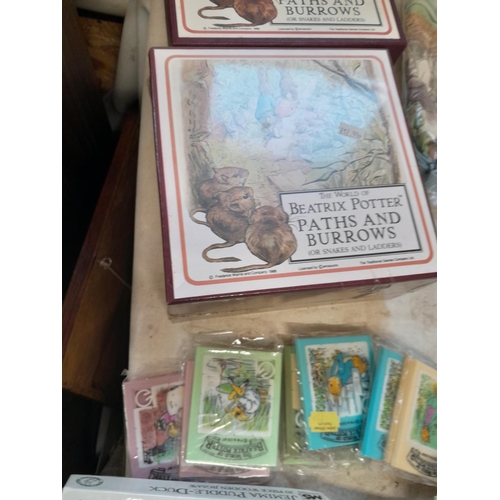 163 - World of Beatrix Potter and Peter Rabbit collectables : boxed sealed and other games and related ite... 