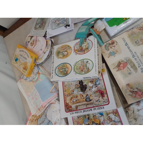 164 - World of Beatrix Potter and Peter Rabbit collectables : fabric and textiles, boxed games and puzzles... 