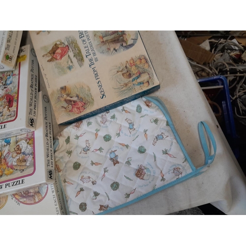 164 - World of Beatrix Potter and Peter Rabbit collectables : fabric and textiles, boxed games and puzzles... 