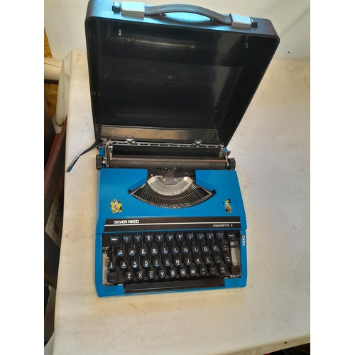 60 - Vintage blue model Silver Reed Silverette typewriter in plastic case