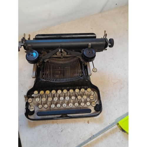 81 - Early 20th century Coronet folding model typewriter with instruction and brush