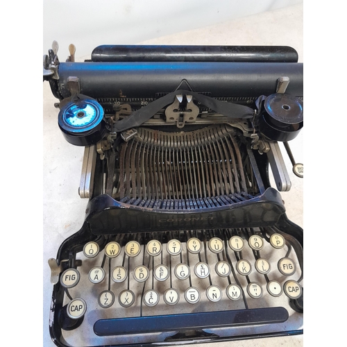 81 - Early 20th century Coronet folding model typewriter with instruction and brush