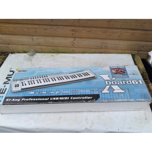 87 - E- Mu 61 keyboard in box of issue with childs ukulele