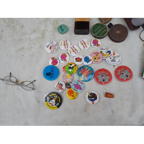 164 - Shoebox of oddments, mid - late 20th century postcards, badges, spectacles advertising tins etc.