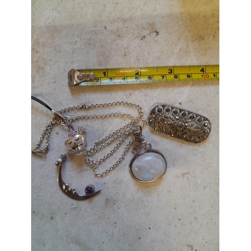 318 - Assorted silver and other costume jewellery : quartz pendant marcasite brooch etc.