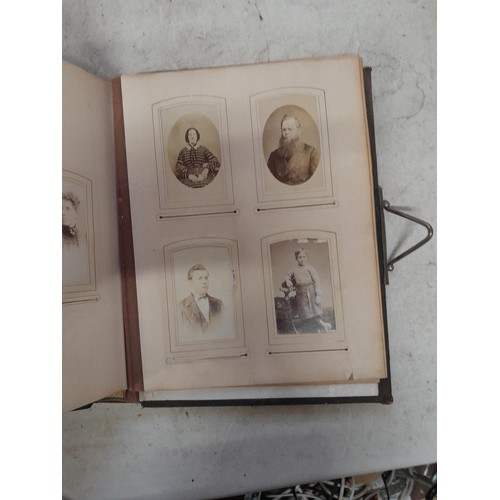 1A - Loosely bound Edwardian album of black and white family photographs