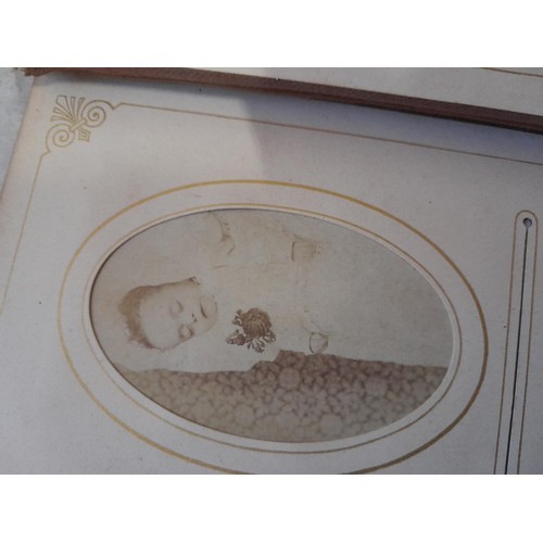 3 - Early 20th century sparsely filled black and white family photograph album, note macabre dead baby p... 