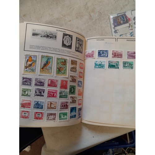 23 - Collection of 20th century stamps of the world mounted in 2 x albums, loose mint and used stamps