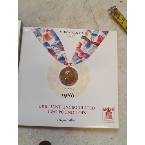 50 - Coins : 1986 Olympic £2 coin presentation pack with other coins